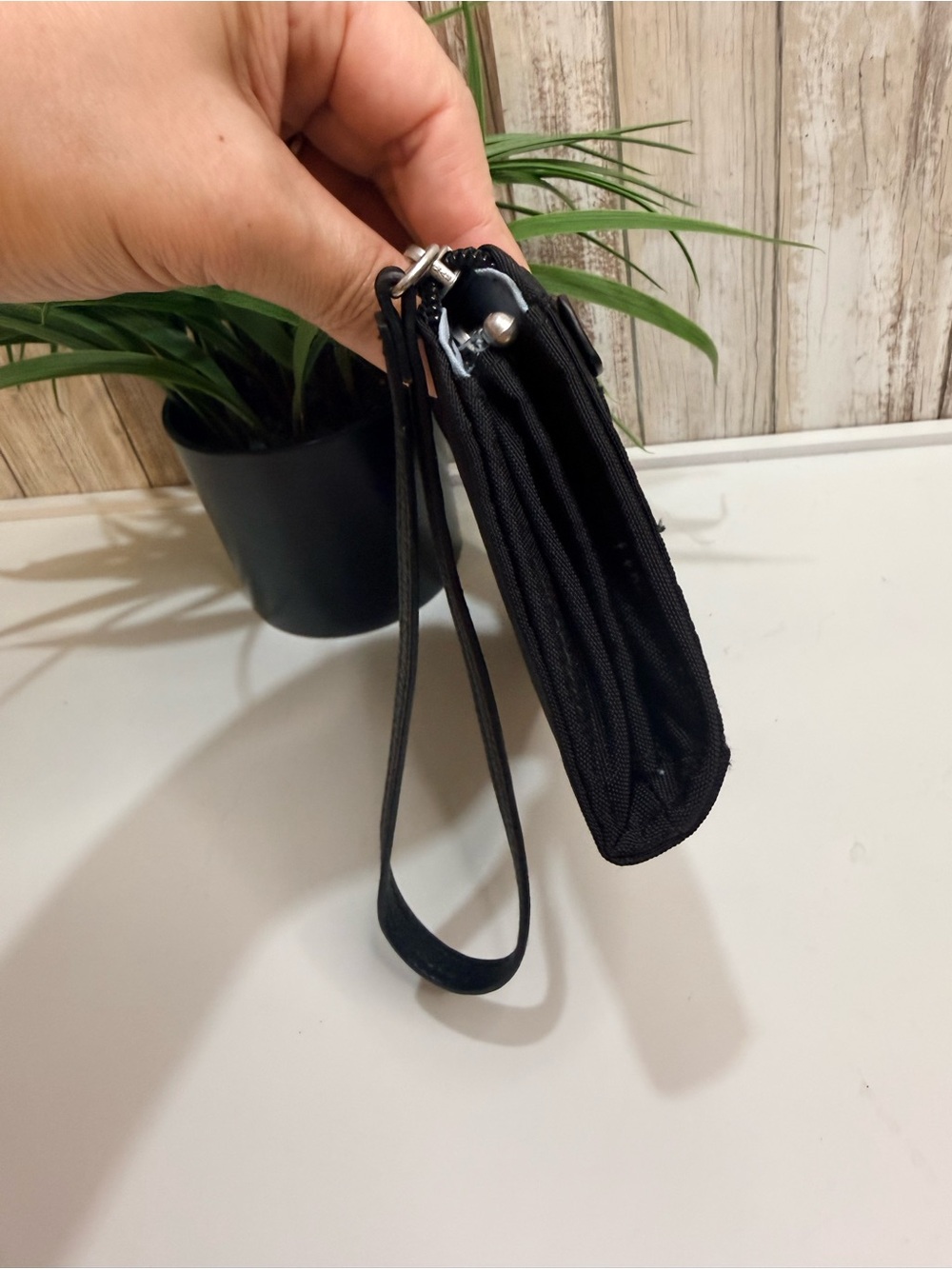 Baggallini Zip Around Wallet featuring a wrist strap and RFID protection, Black - Picture 4 of 8